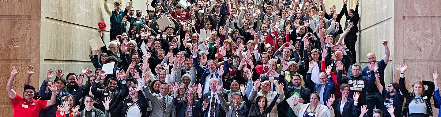 More than 200 university advocates gather on steps in the Oregon State Capitol rotunda
