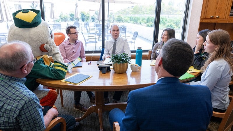 The Duck, President Karl Scholz, and several UO Advocates meet with Oregon House Majority Leader Ben Bowman in his office.