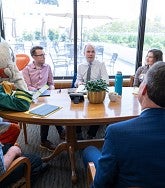 The Duck, President Karl Scholz, and several UO Advocates meet with Oregon House Majority Leader Ben Bowman in his office.